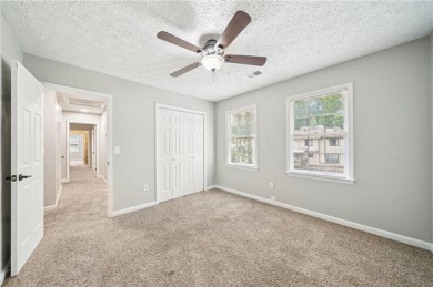 Welcome to this beautiful brick front home nestled on a sweeping on Hidden Hills Country Club in Georgia - for sale on GolfHomes.com, golf home, golf lot