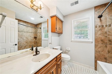Welcome to this beautiful brick front home nestled on a sweeping on Hidden Hills Country Club in Georgia - for sale on GolfHomes.com, golf home, golf lot