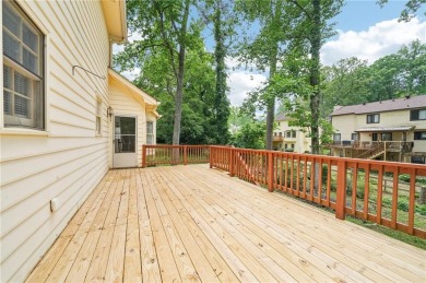 Welcome to this beautiful brick front home nestled on a sweeping on Hidden Hills Country Club in Georgia - for sale on GolfHomes.com, golf home, golf lot