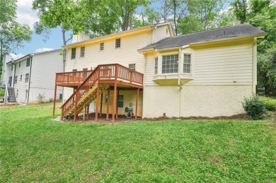 Welcome to this beautiful brick front home nestled on a sweeping on Hidden Hills Country Club in Georgia - for sale on GolfHomes.com, golf home, golf lot