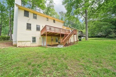 Welcome to this beautiful brick front home nestled on a sweeping on Hidden Hills Country Club in Georgia - for sale on GolfHomes.com, golf home, golf lot