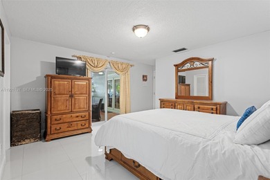 Welcome to this beautifully maintained single-family home in the on Calusa Country Club in Florida - for sale on GolfHomes.com, golf home, golf lot