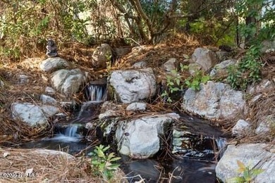 Located in the desirable Reserve section, this truly stand-out on Members Club At St. James Plantation in North Carolina - for sale on GolfHomes.com, golf home, golf lot