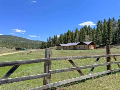 Conveniently located halfway between Taos and Angel Fire, along on El Valle Escondido Golf Course in New Mexico - for sale on GolfHomes.com, golf home, golf lot