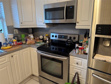 Beautiful and spacious 2BR/2BA condo in the prestigious 55+ on Sunrise Lakes Phase III in Florida - for sale on GolfHomes.com, golf home, golf lot