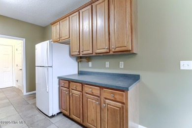 Discover this beautifully maintained 3-bedroom, 2-bathroom home on Belvedere Country Club in North Carolina - for sale on GolfHomes.com, golf home, golf lot