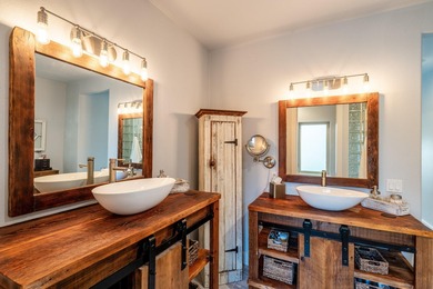 Beautifully upgraded and move-in ready, this two-level paired on The Powder Horn Golf Club - Mountain in Wyoming - for sale on GolfHomes.com, golf home, golf lot