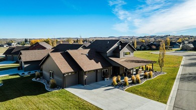 Beautifully upgraded and move-in ready, this two-level paired on The Powder Horn Golf Club - Mountain in Wyoming - for sale on GolfHomes.com, golf home, golf lot