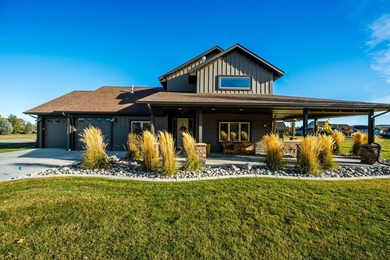 Beautifully upgraded and move-in ready, this two-level paired on The Powder Horn Golf Club - Mountain in Wyoming - for sale on GolfHomes.com, golf home, golf lot