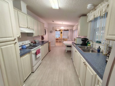 Welcome to this 3-bedroom 2-bath oasis!!! Lot Rent includes all on Spanish Lakes Fairways in Florida - for sale on GolfHomes.com, golf home, golf lot