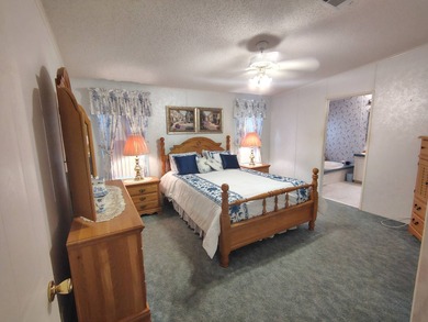 Welcome to this 3-bedroom 2-bath oasis!!! Lot Rent includes all on Spanish Lakes Fairways in Florida - for sale on GolfHomes.com, golf home, golf lot