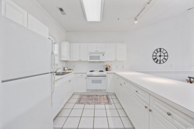 Experience the best of coastal living in this gorgeous top-floor on Myrtlewood Golf Course and Club  in South Carolina - for sale on GolfHomes.com, golf home, golf lot
