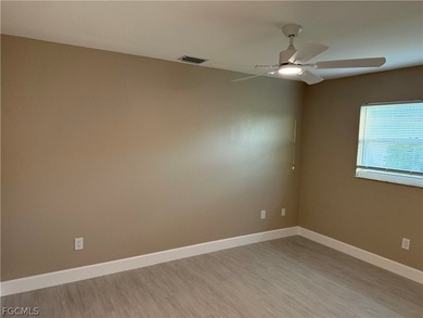 Spacious 3 bedroom 2 bath pool home in CAPE ROYAL, a gated golf on Royal Tee Country Club in Florida - for sale on GolfHomes.com, golf home, golf lot