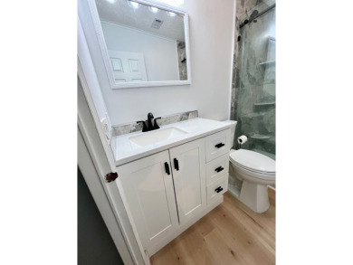 Spacious 2 bed, 2 bath home with open floor plan.Large master on Pine Lakes Country Club in Florida - for sale on GolfHomes.com, golf home, golf lot
