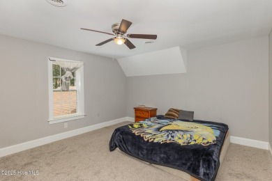 Situated alongside the Wilson Country Club golf course, this on Wilson Country Club in North Carolina - for sale on GolfHomes.com, golf home, golf lot