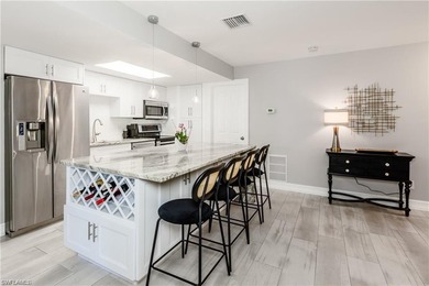 Discover this beautifully remodeled upstairs condo in the heart on The Glades Golf and Country Club in Florida - for sale on GolfHomes.com, golf home, golf lot