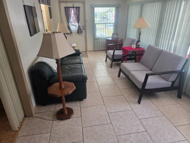 TWO DRIVEWAYS PROVIDE ADDITIONAL PARKING - NICE CORNER LOT - on Grasslands Golf and Country Club in Florida - for sale on GolfHomes.com, golf home, golf lot