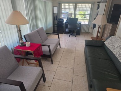TWO DRIVEWAYS PROVIDE ADDITIONAL PARKING - NICE CORNER LOT - on Grasslands Golf and Country Club in Florida - for sale on GolfHomes.com, golf home, golf lot
