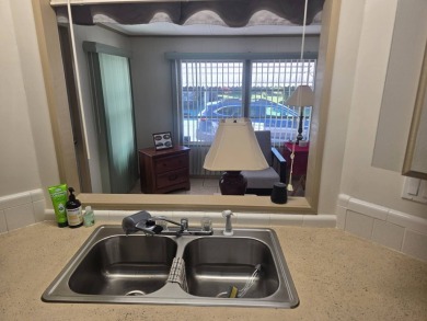 TWO DRIVEWAYS PROVIDE ADDITIONAL PARKING - NICE CORNER LOT - on Grasslands Golf and Country Club in Florida - for sale on GolfHomes.com, golf home, golf lot