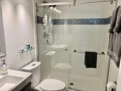 Beautifully renovated home with an amazing lake and golf view in on The Country Club At Boca Raton in Florida - for sale on GolfHomes.com, golf home, golf lot