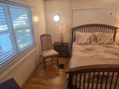 TWO DRIVEWAYS PROVIDE ADDITIONAL PARKING - NICE CORNER LOT - on Grasslands Golf and Country Club in Florida - for sale on GolfHomes.com, golf home, golf lot