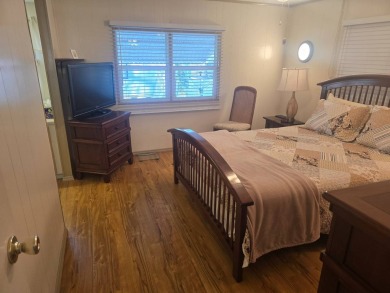 TWO DRIVEWAYS PROVIDE ADDITIONAL PARKING - NICE CORNER LOT - on Grasslands Golf and Country Club in Florida - for sale on GolfHomes.com, golf home, golf lot