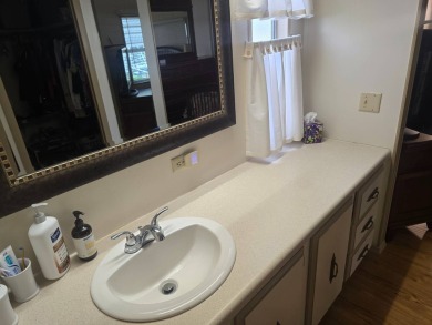 TWO DRIVEWAYS PROVIDE ADDITIONAL PARKING - NICE CORNER LOT - on Grasslands Golf and Country Club in Florida - for sale on GolfHomes.com, golf home, golf lot