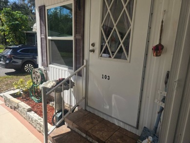 TWO DRIVEWAYS PROVIDE ADDITIONAL PARKING - NICE CORNER LOT - on Grasslands Golf and Country Club in Florida - for sale on GolfHomes.com, golf home, golf lot