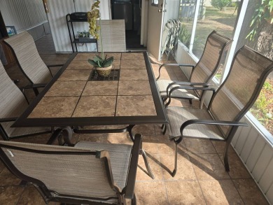 TWO DRIVEWAYS PROVIDE ADDITIONAL PARKING - NICE CORNER LOT - on Grasslands Golf and Country Club in Florida - for sale on GolfHomes.com, golf home, golf lot