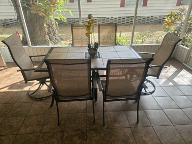 TWO DRIVEWAYS PROVIDE ADDITIONAL PARKING - NICE CORNER LOT - on Grasslands Golf and Country Club in Florida - for sale on GolfHomes.com, golf home, golf lot