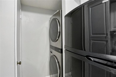 Experience elevated city living in this stunning one-bedroom on Bobby Jones Golf Club in Georgia - for sale on GolfHomes.com, golf home, golf lot