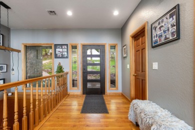 Experience lakeside living at its finest with this custom-built on The Coves Golf Course in Oklahoma - for sale on GolfHomes.com, golf home, golf lot