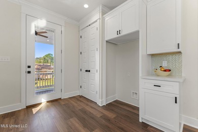 Brand New Coastal Estate Home. Minutes to quiet sleepy Pass on Pass Christian Isles Golf Club in Mississippi - for sale on GolfHomes.com, golf home, golf lot