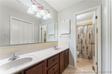 Nestled on the picturesque 10th fairway, this beautiful townhome on Gates Four Golf and Country Club in North Carolina - for sale on GolfHomes.com, golf home, golf lot