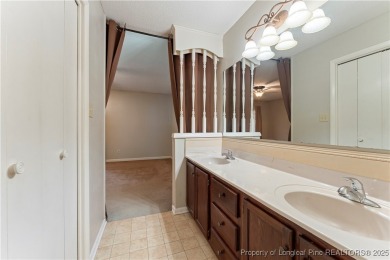 Nestled on the picturesque 10th fairway, this beautiful townhome on Gates Four Golf and Country Club in North Carolina - for sale on GolfHomes.com, golf home, golf lot