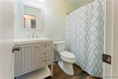 Nestled on the picturesque 10th fairway, this beautiful townhome on Gates Four Golf and Country Club in North Carolina - for sale on GolfHomes.com, golf home, golf lot