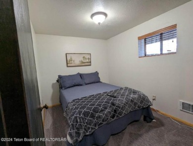 This charming home is nestled on a quiet treed street, offers a on Cedar Creek Golf Course in Wyoming - for sale on GolfHomes.com, golf home, golf lot