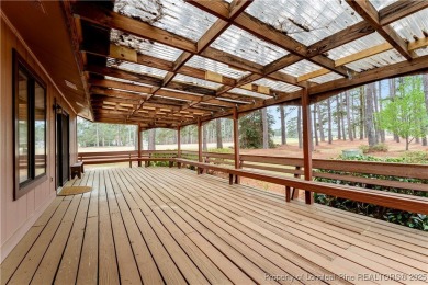 Nestled on the picturesque 10th fairway, this beautiful townhome on Gates Four Golf and Country Club in North Carolina - for sale on GolfHomes.com, golf home, golf lot