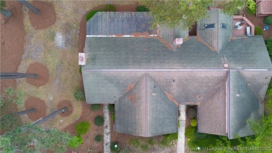 Nestled on the picturesque 10th fairway, this beautiful townhome on Gates Four Golf and Country Club in North Carolina - for sale on GolfHomes.com, golf home, golf lot