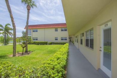 Charming, light-filled 1BR/1.5BA first-floor end unit nestled in on The American Golf Club in Florida - for sale on GolfHomes.com, golf home, golf lot