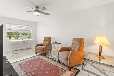 Charming, light-filled 1BR/1.5BA first-floor end unit nestled in on The American Golf Club in Florida - for sale on GolfHomes.com, golf home, golf lot