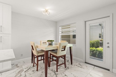 Charming, light-filled 1BR/1.5BA first-floor end unit nestled in on The American Golf Club in Florida - for sale on GolfHomes.com, golf home, golf lot