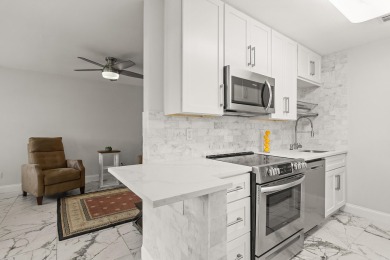 Charming, light-filled 1BR/1.5BA first-floor end unit nestled in on The American Golf Club in Florida - for sale on GolfHomes.com, golf home, golf lot