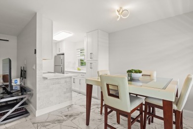 Charming, light-filled 1BR/1.5BA first-floor end unit nestled in on The American Golf Club in Florida - for sale on GolfHomes.com, golf home, golf lot