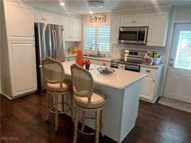 Gorgeous, updated home in much desired Tamiami Village. This on Six Lakes Country Club in Florida - for sale on GolfHomes.com, golf home, golf lot