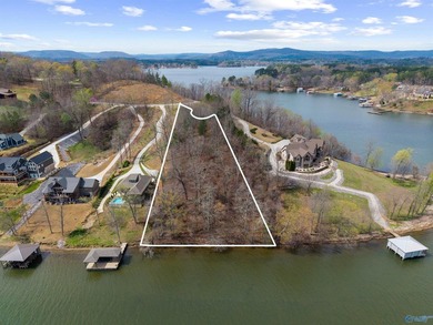 This exceptional lake lot provides 220 feet of shoreline on the on Goose Pond Colony Resort - Lake Golf Course in Alabama - for sale on GolfHomes.com, golf home, golf lot