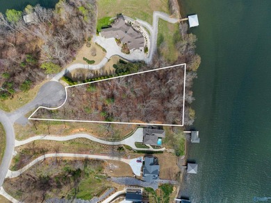 This exceptional lake lot provides 220 feet of shoreline on the on Goose Pond Colony Resort - Lake Golf Course in Alabama - for sale on GolfHomes.com, golf home, golf lot