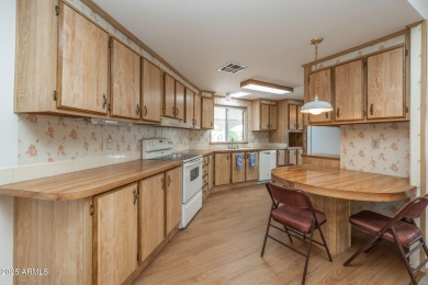 Nicely maintained home. Vinyl plank flooring in entry, kitchen on Oakwood Golf Club  in Arizona - for sale on GolfHomes.com, golf home, golf lot