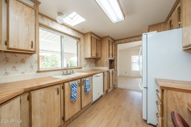 Nicely maintained home. Vinyl plank flooring in entry, kitchen on Oakwood Golf Club  in Arizona - for sale on GolfHomes.com, golf home, golf lot