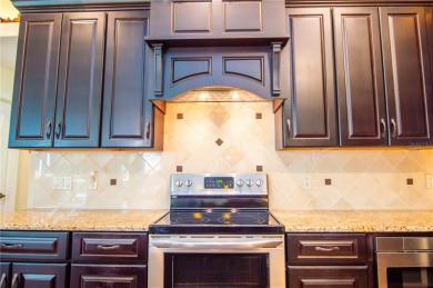 GORGEOUS 3 BEDROOM - 2 BATH - 2 CAR GARAGE POOL HOME AT THE on Tarpon Woods Golf Club in Florida - for sale on GolfHomes.com, golf home, golf lot